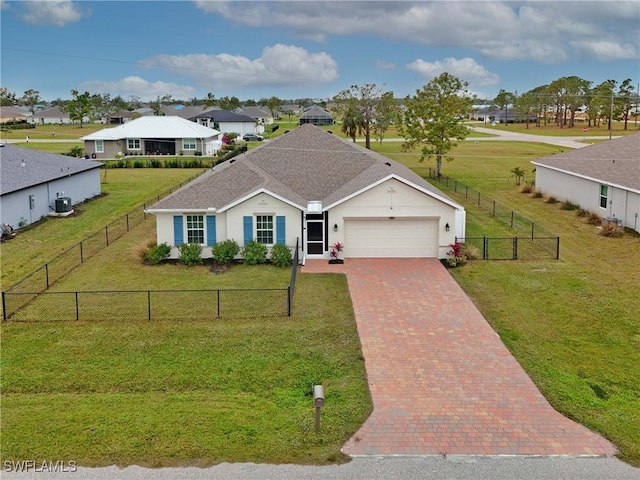 single story home with a garage and a front lawn