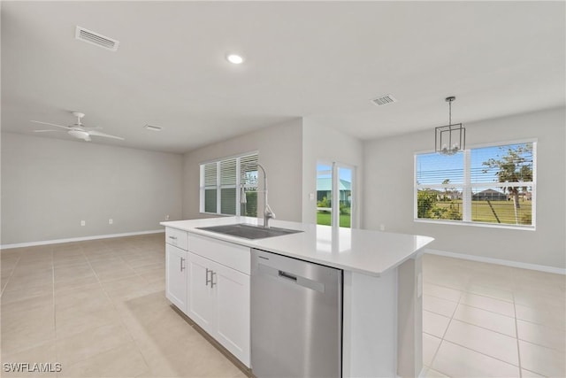 kitchen featuring pendant lighting, white cabinets, dishwasher, an island with sink, and sink