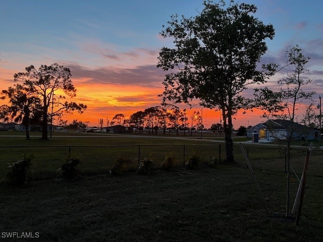 view of yard at dusk