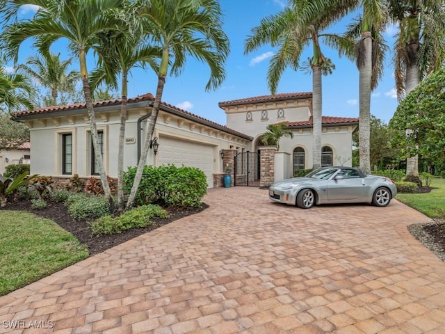 mediterranean / spanish-style home featuring a garage