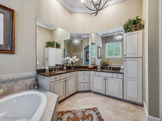 bathroom featuring crown molding, vanity, and a chandelier