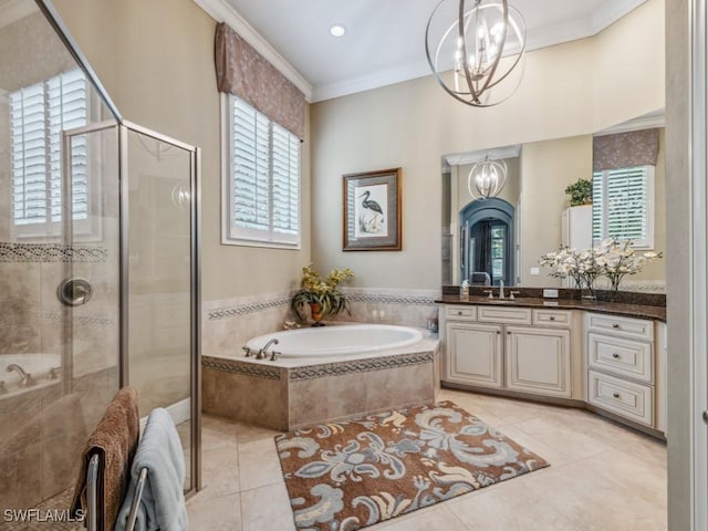 bathroom with an inviting chandelier, tile patterned floors, ornamental molding, and separate shower and tub