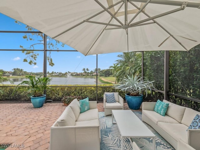 view of patio / terrace featuring an outdoor living space and a water view