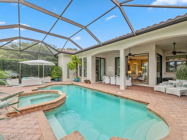 view of swimming pool featuring a lanai, ceiling fan, an outdoor living space, a patio area, and an in ground hot tub