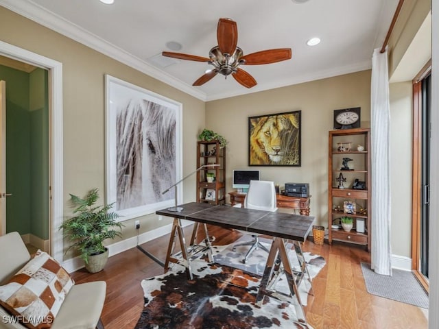 office space with ornamental molding, ceiling fan, and light hardwood / wood-style flooring