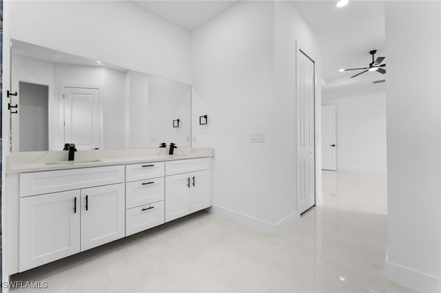 bathroom featuring ceiling fan and vanity