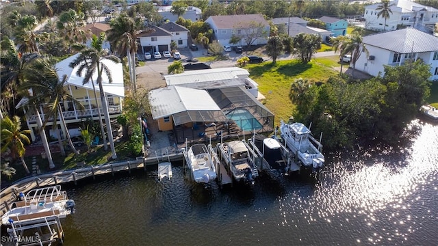 bird's eye view featuring a water view and a residential view