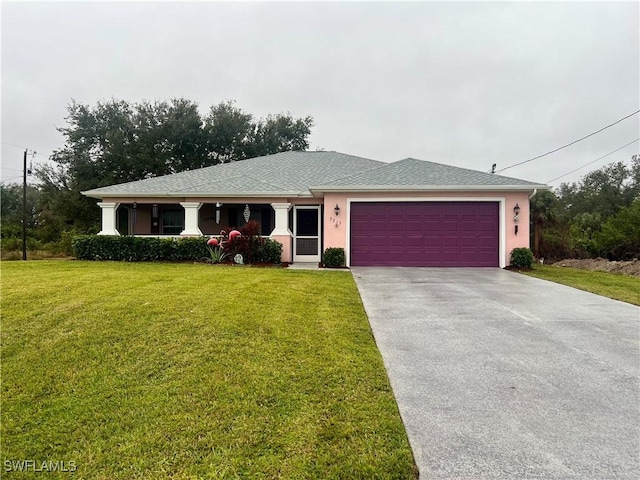 view of front facade with a front lawn and a garage