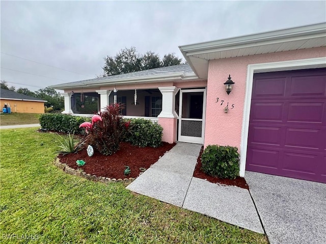 view of front of house with a garage and a front lawn