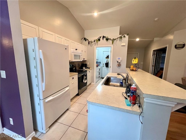 kitchen with white cabinets, vaulted ceiling, sink, and white appliances