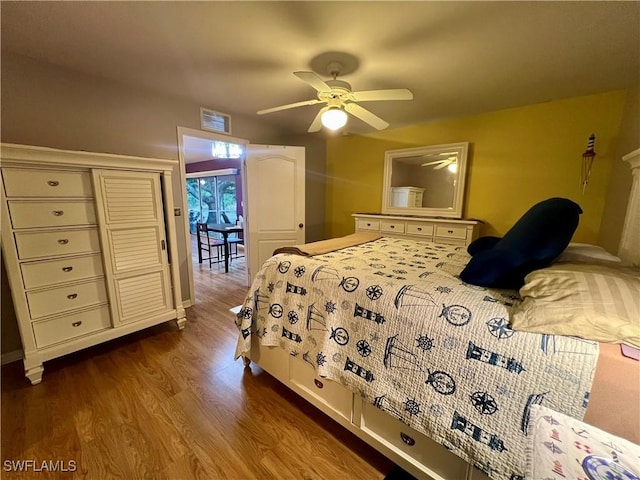 bedroom featuring ceiling fan and hardwood / wood-style floors