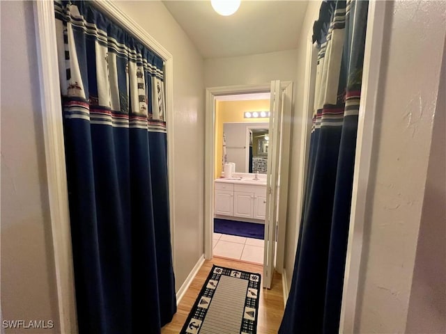 bathroom featuring vanity and wood-type flooring