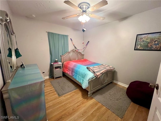 bedroom featuring ceiling fan and light wood-type flooring