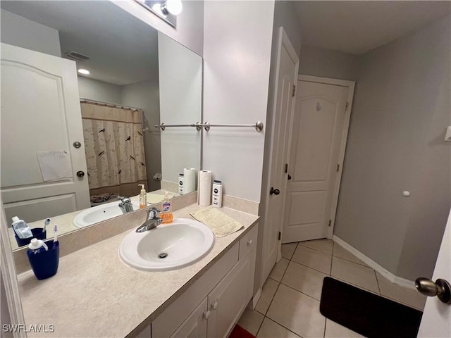 bathroom featuring vanity, tile patterned floors, and a shower with shower curtain