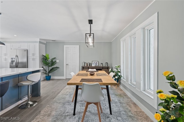 dining area with hardwood / wood-style floors