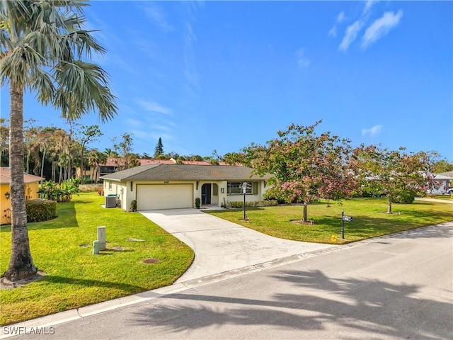 4348 Beechwood Lake Dr, Naples, FL 34112 - view of front facade featuring a garage and a front lawn