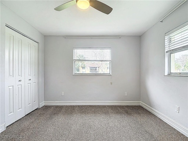 4348 Beechwood Lake Dr, Naples, FL 34112 - unfurnished bedroom with carpet, ceiling fan, and a closet