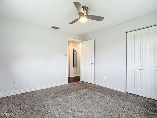 4348 Beechwood Lake Dr, Naples, FL 34112 - unfurnished bedroom featuring dark carpet, a closet, and ceiling fan