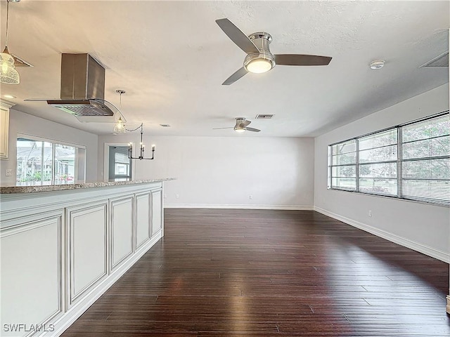 4348 Beechwood Lake Dr, Naples, FL 34112 - empty room with dark wood-type flooring and ceiling fan with notable chandelier