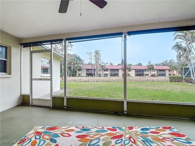 4348 Beechwood Lake Dr, Naples, FL 34112 - unfurnished sunroom with ceiling fan