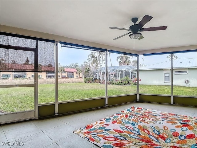 4348 Beechwood Lake Dr, Naples, FL 34112 - unfurnished sunroom featuring ceiling fan