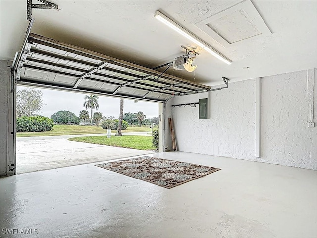4348 Beechwood Lake Dr, Naples, FL 34112 - garage featuring a garage door opener, a lawn, and electric panel