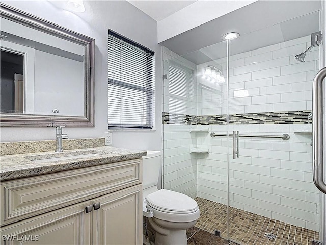 4348 Beechwood Lake Dr, Naples, FL 34112 - bathroom with vanity, toilet, and a shower with door