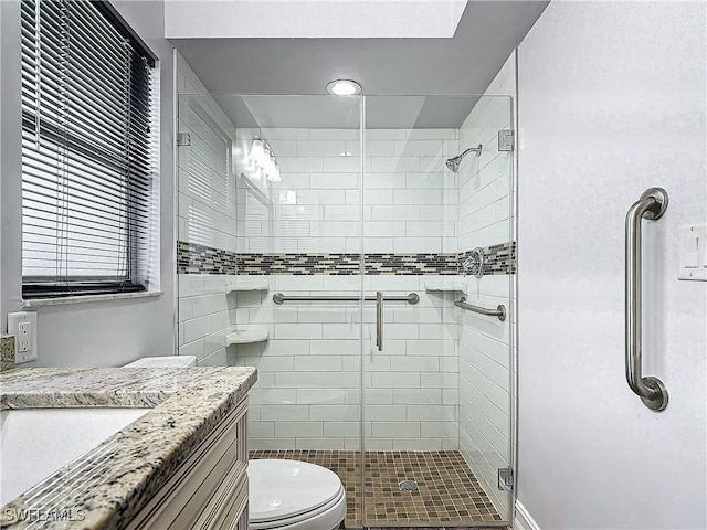 4348 Beechwood Lake Dr, Naples, FL 34112 - bathroom featuring vanity, an enclosed shower, and toilet