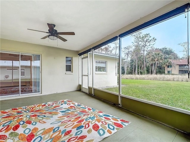 4348 Beechwood Lake Dr, Naples, FL 34112 - unfurnished sunroom featuring ceiling fan