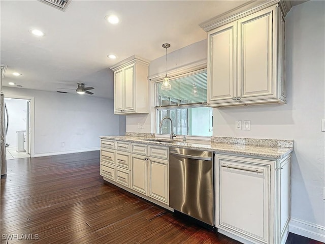 4348 Beechwood Lake Dr, Naples, FL 34112 - kitchen with dark wood-type flooring, sink, pendant lighting, stainless steel appliances, and cream cabinets