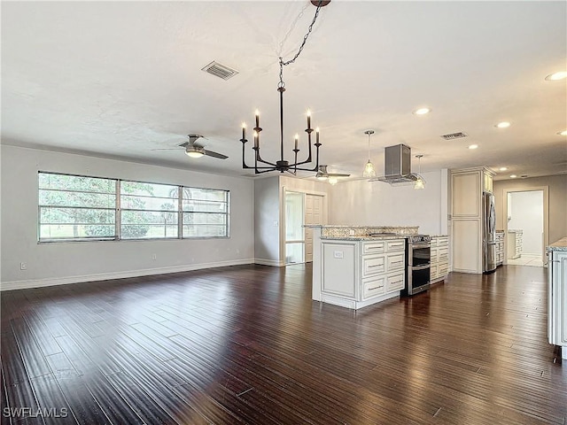 4348 Beechwood Lake Dr, Naples, FL 34112 - kitchen featuring white cabinetry, stainless steel appliances, light stone counters, island exhaust hood, and decorative light fixtures