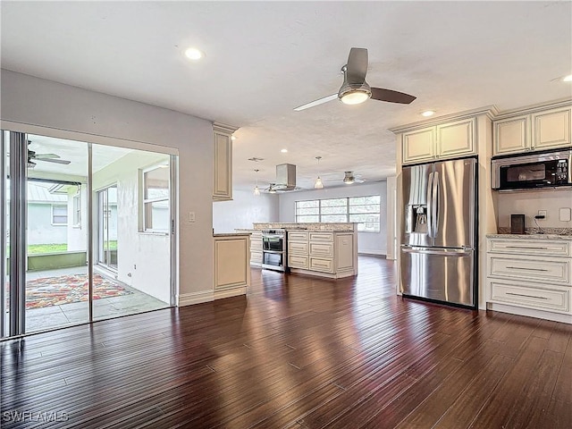 4348 Beechwood Lake Dr, Naples, FL 34112 - kitchen featuring cream cabinets, island exhaust hood, dark hardwood / wood-style floors, and appliances with stainless steel finishes