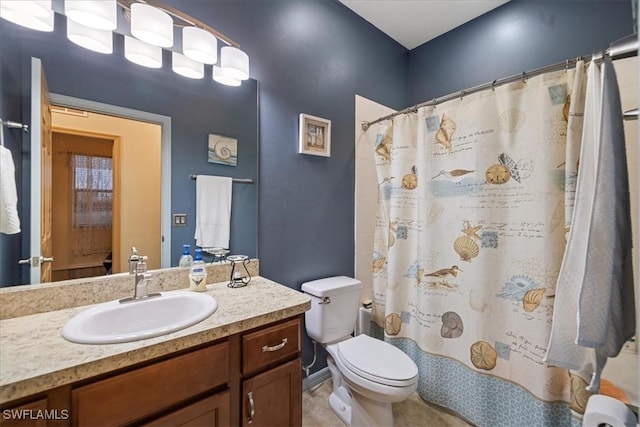 bathroom featuring vanity, toilet, and a shower with shower curtain