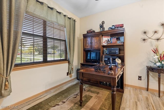 office space with light hardwood / wood-style flooring