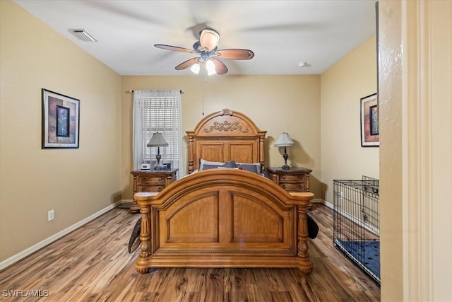 bedroom featuring hardwood / wood-style floors and ceiling fan