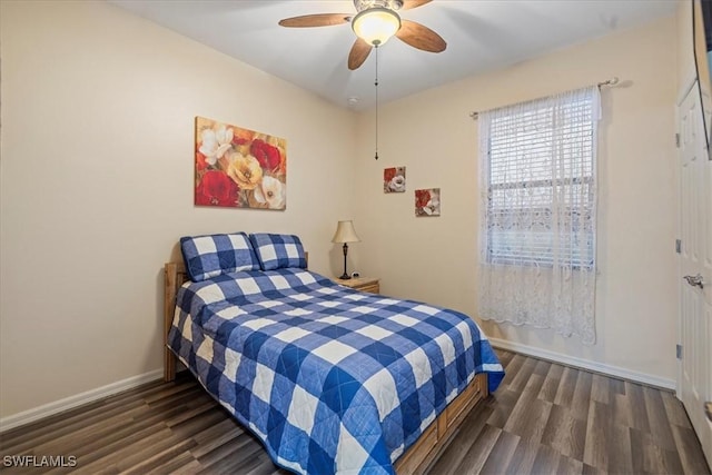 bedroom with ceiling fan and dark hardwood / wood-style floors