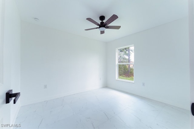 spare room with ceiling fan