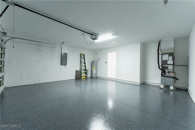 garage featuring electric panel, water heater, and a garage door opener