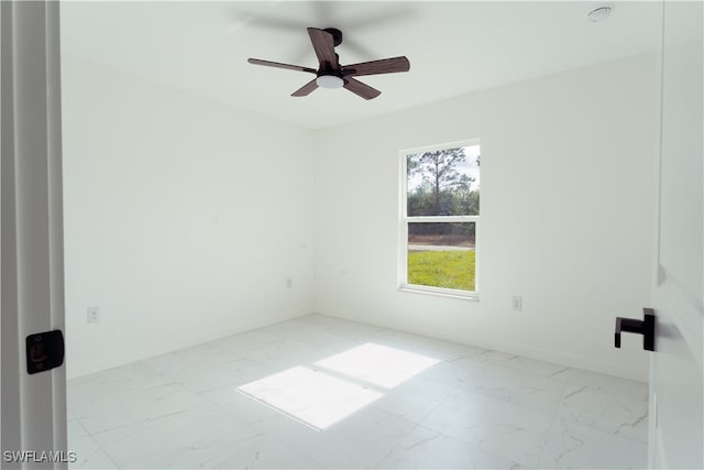 spare room with ceiling fan