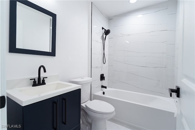 full bathroom featuring toilet, vanity, and tiled shower / bath