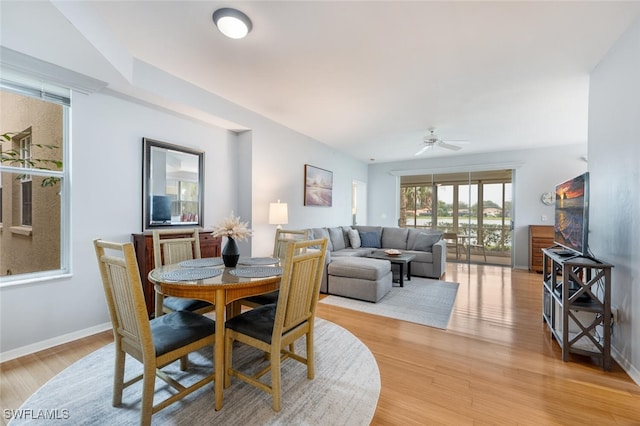 dining area featuring light hardwood / wood-style floors and ceiling fan