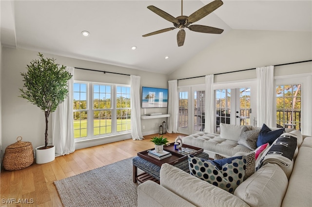 living room with french doors, ceiling fan, high vaulted ceiling, and hardwood / wood-style floors