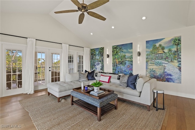 living room featuring french doors, ceiling fan, high vaulted ceiling, and hardwood / wood-style flooring