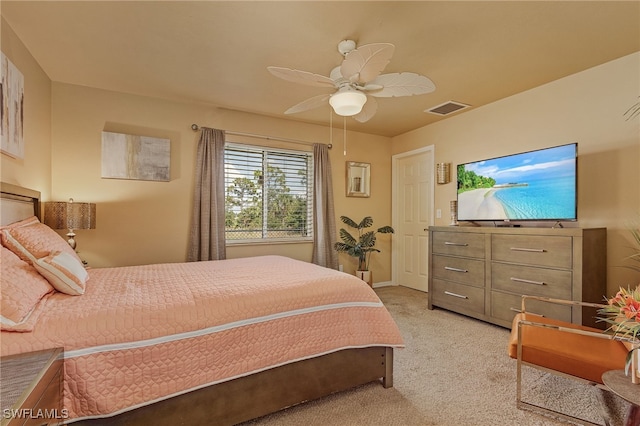 carpeted bedroom with ceiling fan