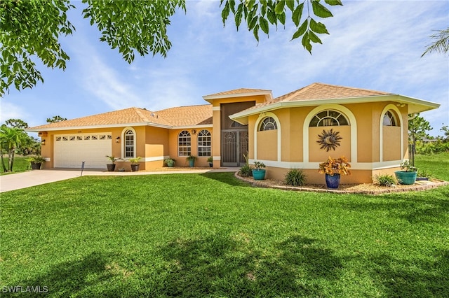 mediterranean / spanish-style house with a garage and a front lawn