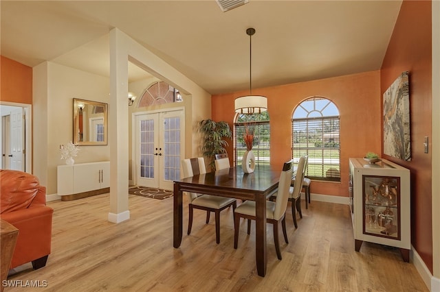 dining area featuring french doors and light hardwood / wood-style floors