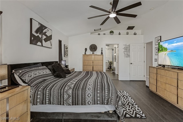 bedroom with ceiling fan, vaulted ceiling, dark hardwood / wood-style flooring, and connected bathroom