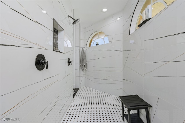 bathroom with tiled shower