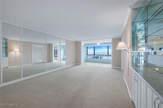 2777 W Gulf Dr Unit 309, Sanibel, FL 33957 - unfurnished bedroom with light carpet, visible vents, crown molding, and baseboards