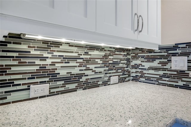2777 W Gulf Dr Unit 309, Sanibel, FL 33957 - interior details featuring white cabinetry and light stone counters
